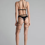 Back view of black open panty – sexy NZ lingerie, styled with sheer stockings, garter belt, and flirty lingerie sets.