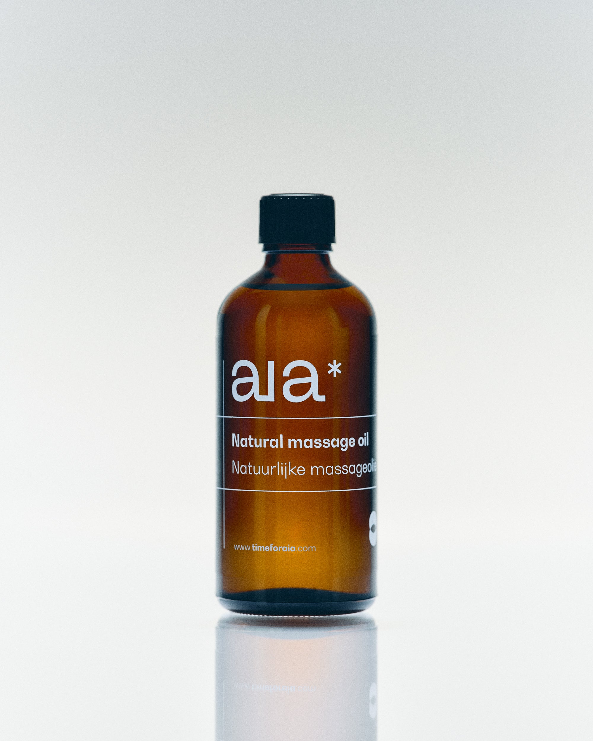 Aia* 100% Natural Massage Oil in amber glass bottle, 100ml, showcasing clean design and eco-friendly packaging, perfect for daily hydration.