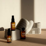 Aia Intimacy Essentials Box displayed with natural lubricant, massage oil, and stimulating gel bottles.