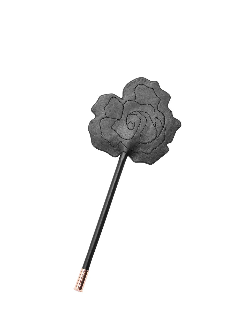 Mewmew Fleur du Mal rose-shaped leather paddle – elegant adult toy NZ, perfect for playful intimacy with lingerie, cuffs, and blindfold.